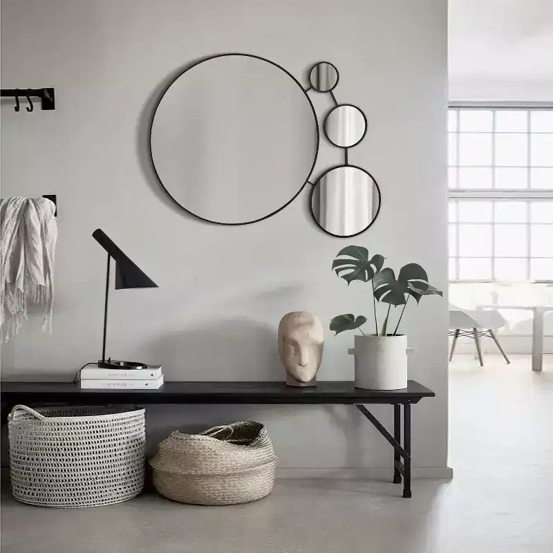 LuxenHome Round Wall Mirror, 34.5L x 24.5W Circles Black Metal Frame Modern Decorative Wall Mirror